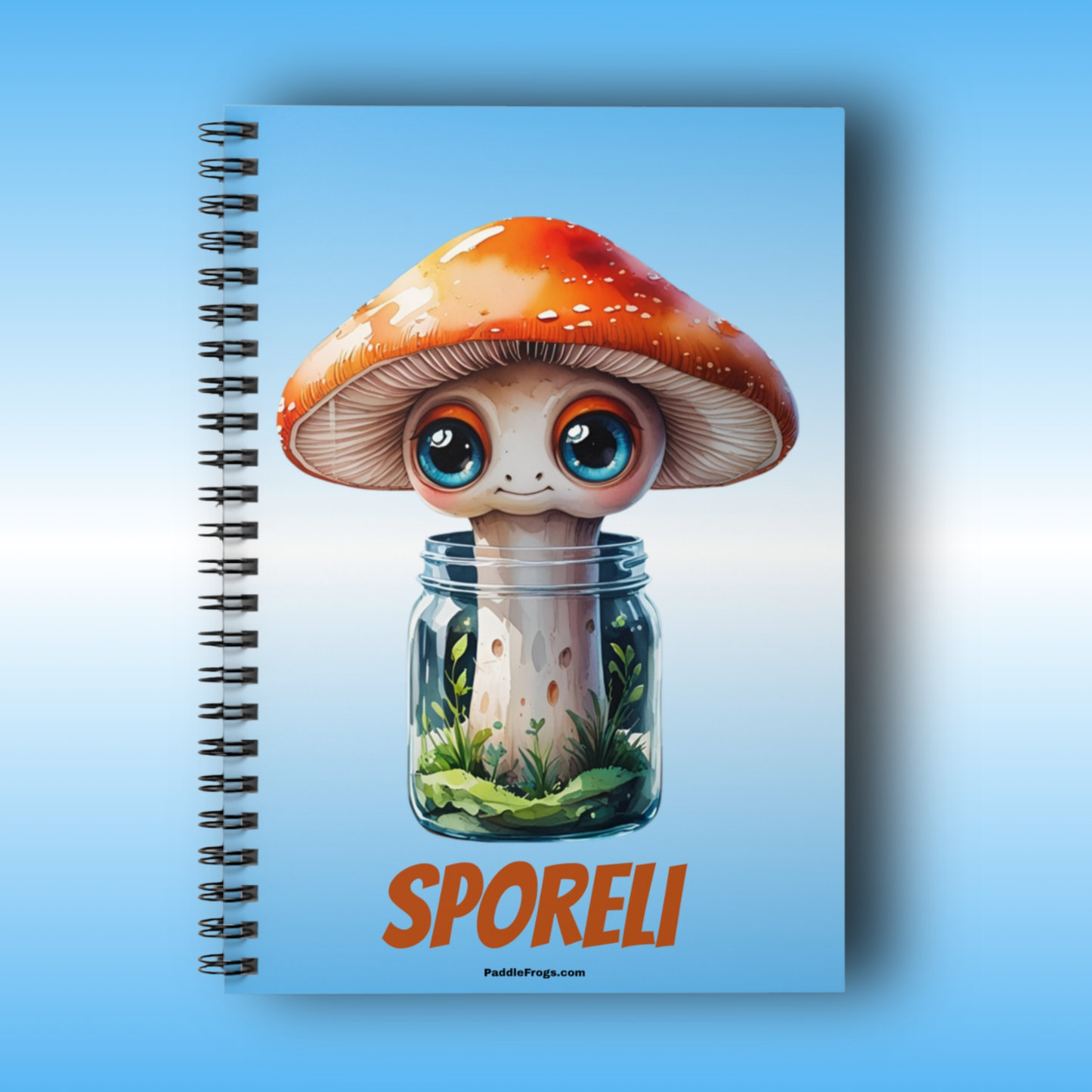 Paddle Frogs | Sporeli Notebook with a cartoon mushroom design on a blue background