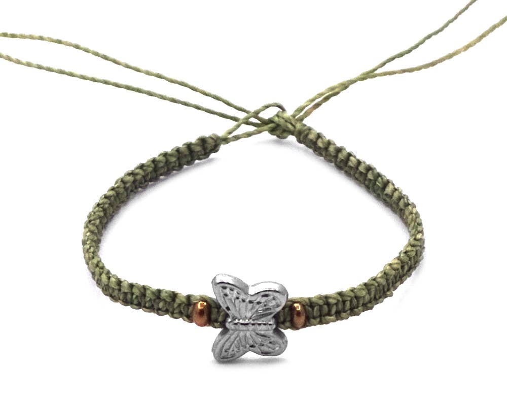 Green braided bracelet with a silver butterfly charm on a white background