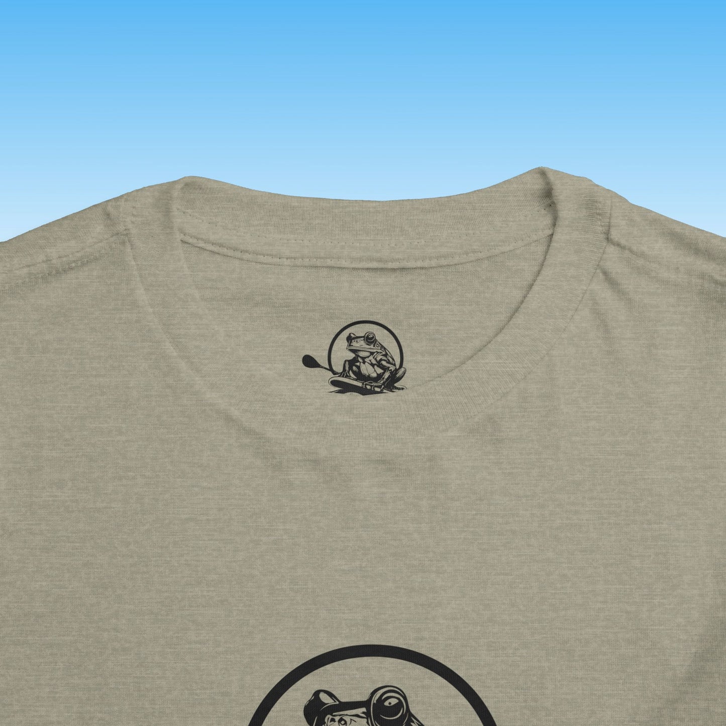 Beige t-shirt with a black logo on a blue background
