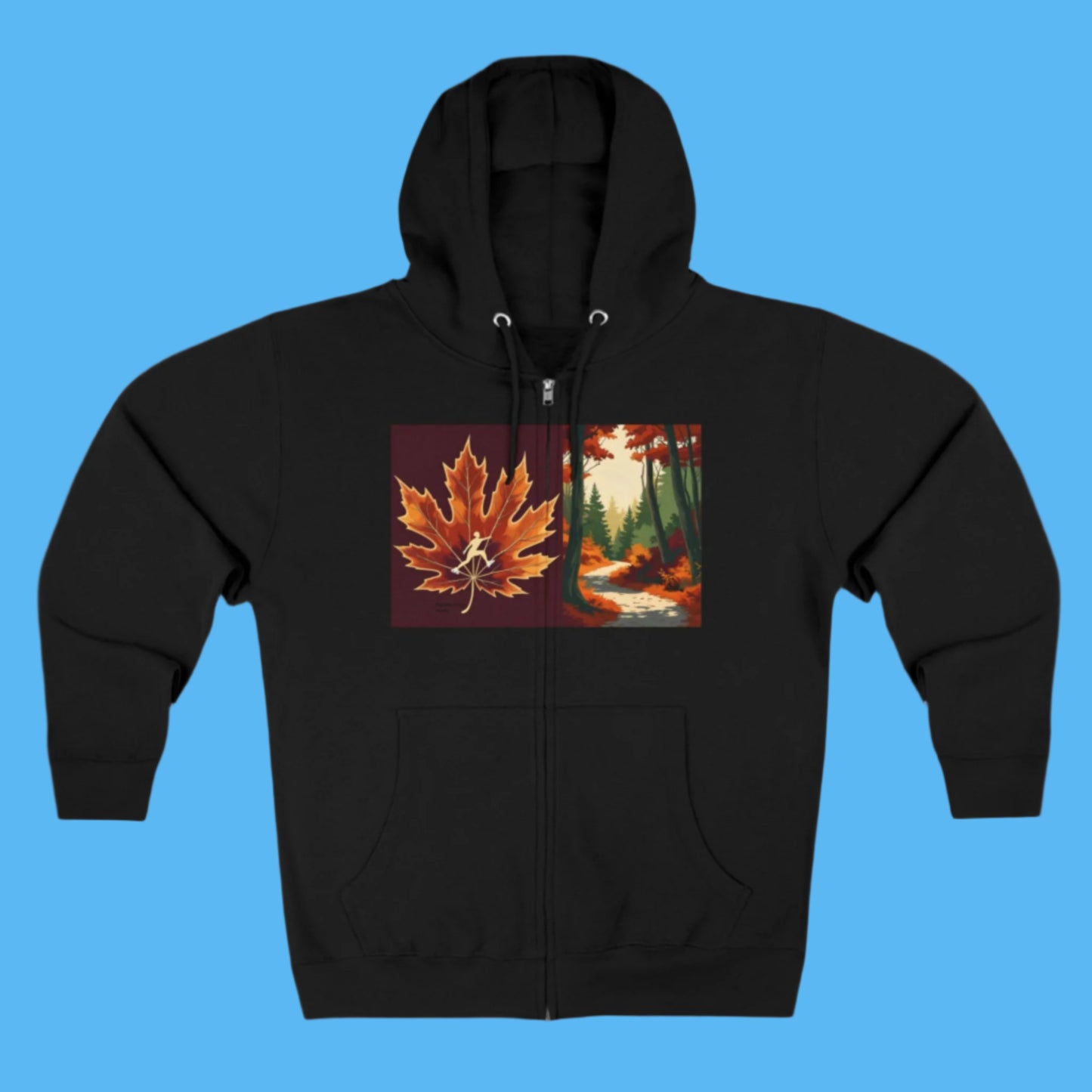 Autumn Trail Black hoodie with Zipper and Pockets. Cozy hood and a maple leaf with an ice skater and fall season forest design on a path to Autumn's Trail in the Paddle Frogs crew story.