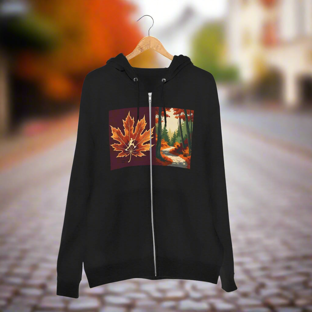 Autumn Trail Ice Skating edition 2025 - 2026 Black hoodie with a colorful leaf design on the trail to the Paddle Frogs crew fall hangout Black hoodie with a brown maple leaf design on the back against a white background Black hoodie with a zipper featuring a maple leaf and forest design on a hanger.