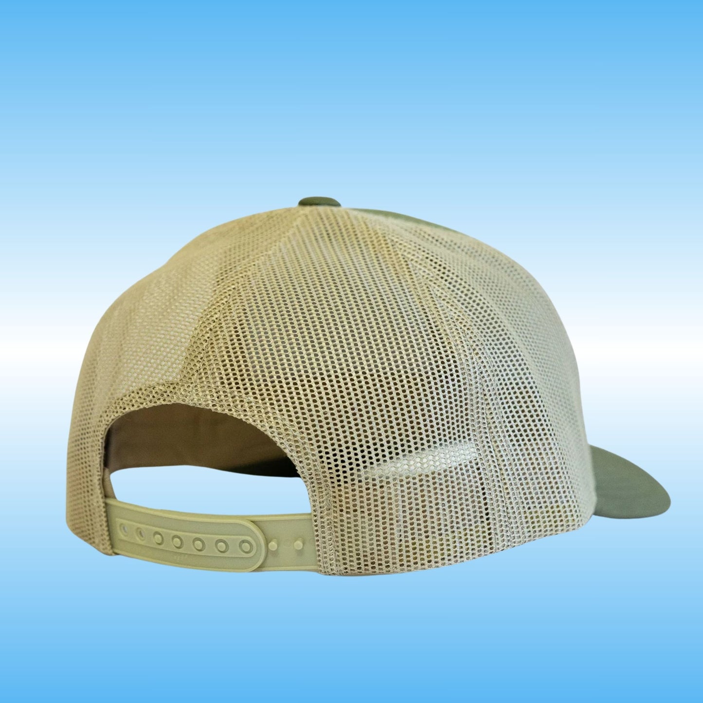 A beige mesh-back baseball cap shown from the back, featuring a tan adjustable strap and a muted olive-green visor, set against a blue gradient background.