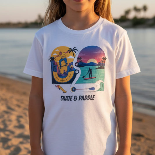 girl wearing a white t-shirt with 'Skate & Paddle' graphic design on a beach.