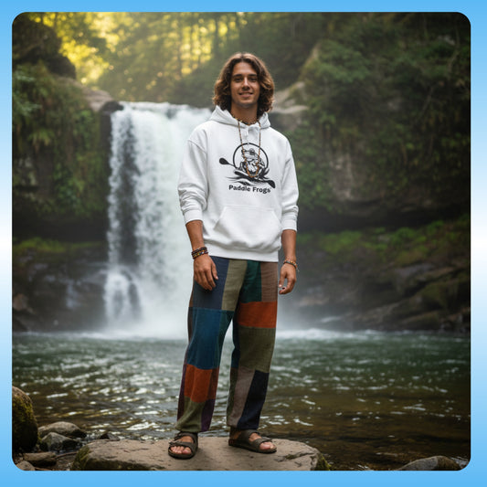 Extra Cozy & warm white Paddle Frogs Outdoor Gear Hoodie pull over | Person wearing a hoodie and colorful pants standing in front of a waterfall.