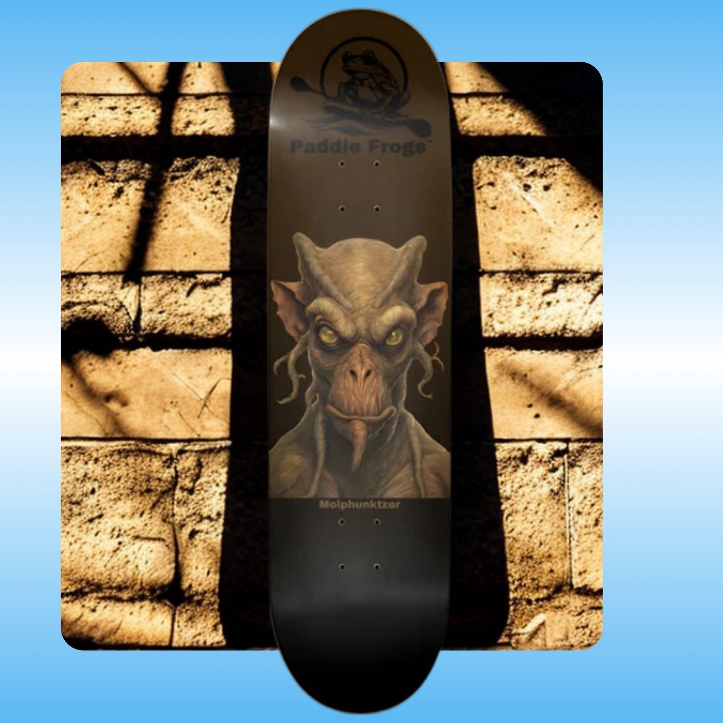 Molphunktzer | in the shadows | Paddle Frogs Pro Skate Shop | Skateboard deck with a goblin graphic on a stone wall background