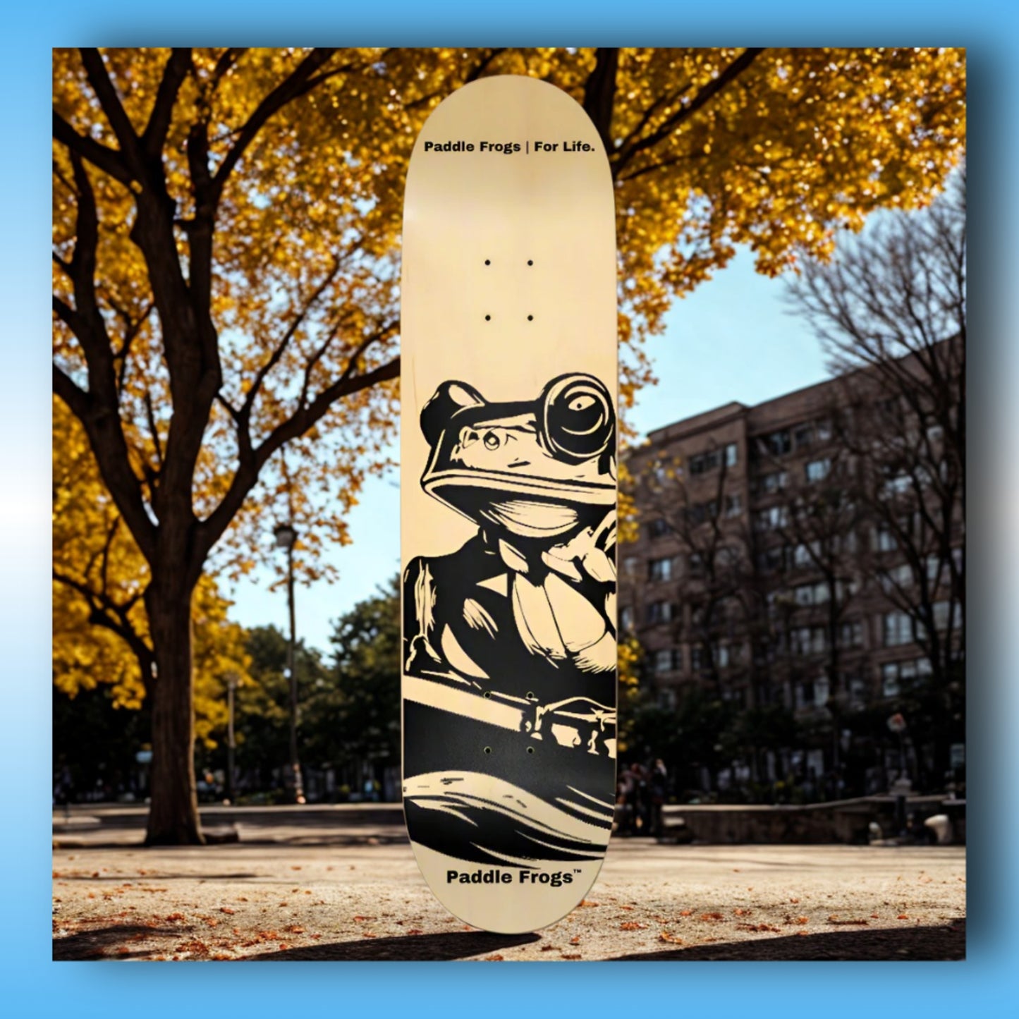 Original 7-Layer Maple Skateboard Deck - Paddle Frogs - City Park | Skateboard deck with frog design and 'Paddle Frogs' branding in an urban park setting.