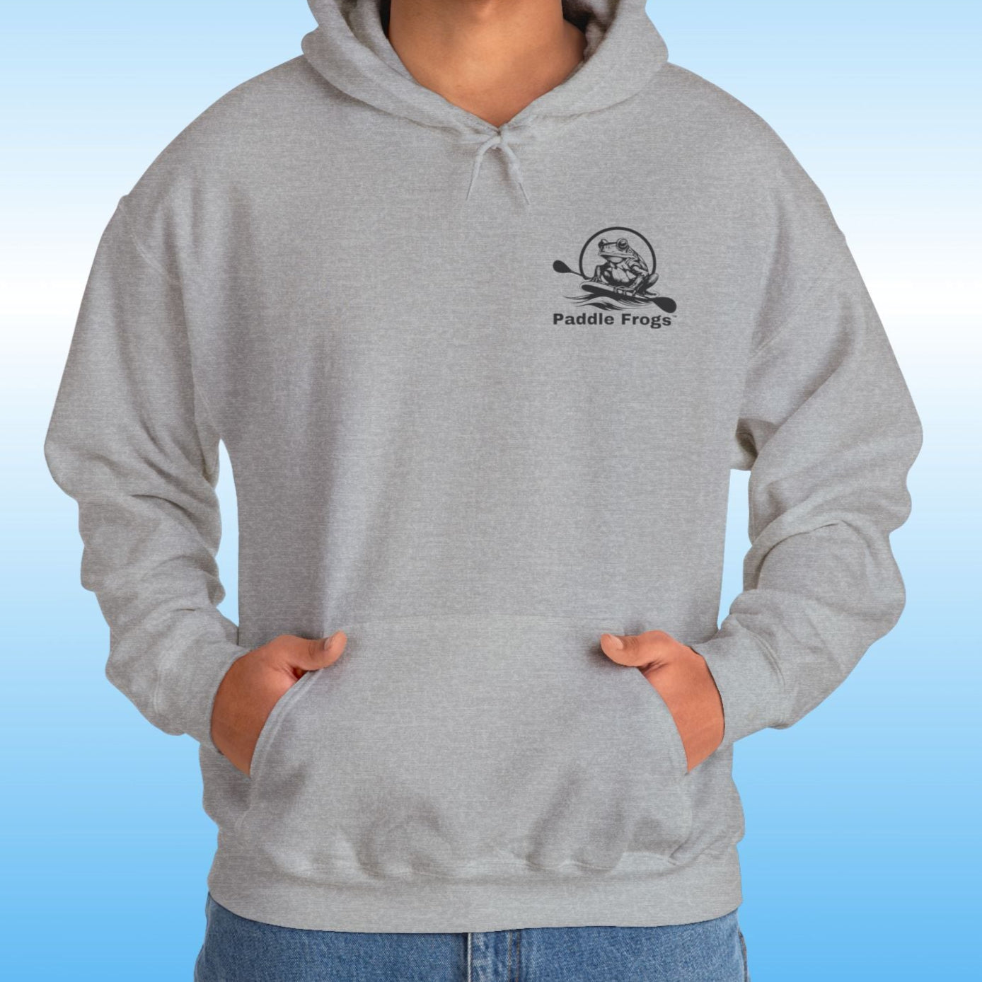 Paddle Frogs original Hoodie in multiple colors Paddle boarding frog Person man wearing a heather gray hoodie with a logo on a blue background