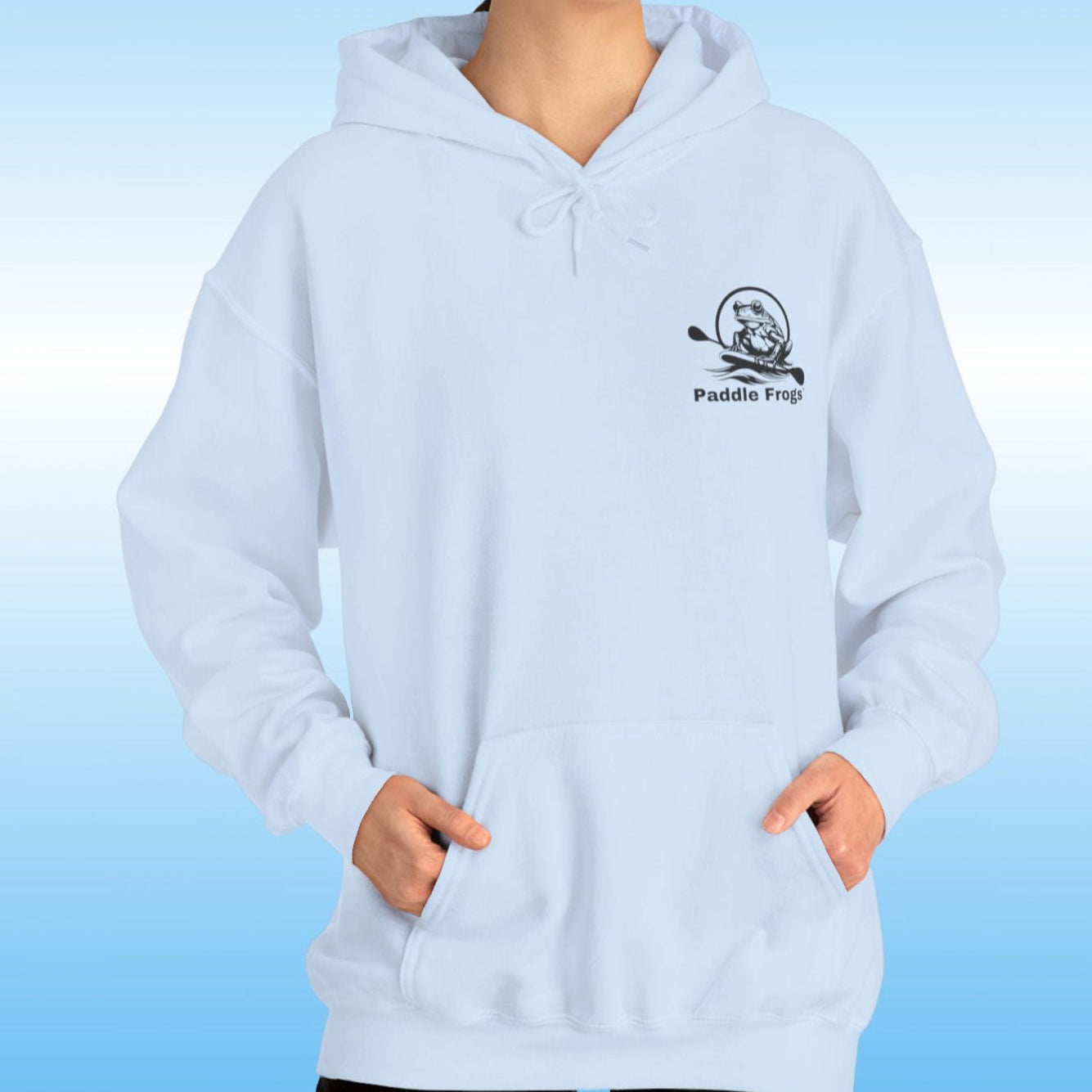 Paddle Frogs original Hoodie in multiple colors Paddle boarding frog Person wearing a light sky blue hoodie with a logo on a blue background