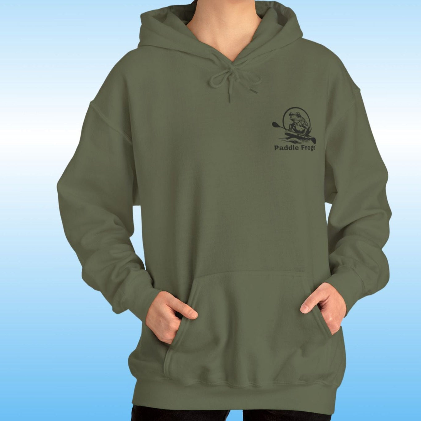 Paddle Frogs original Hoodie in multiple colors Person wearing a green hoodie with a logo on a blue gradient background