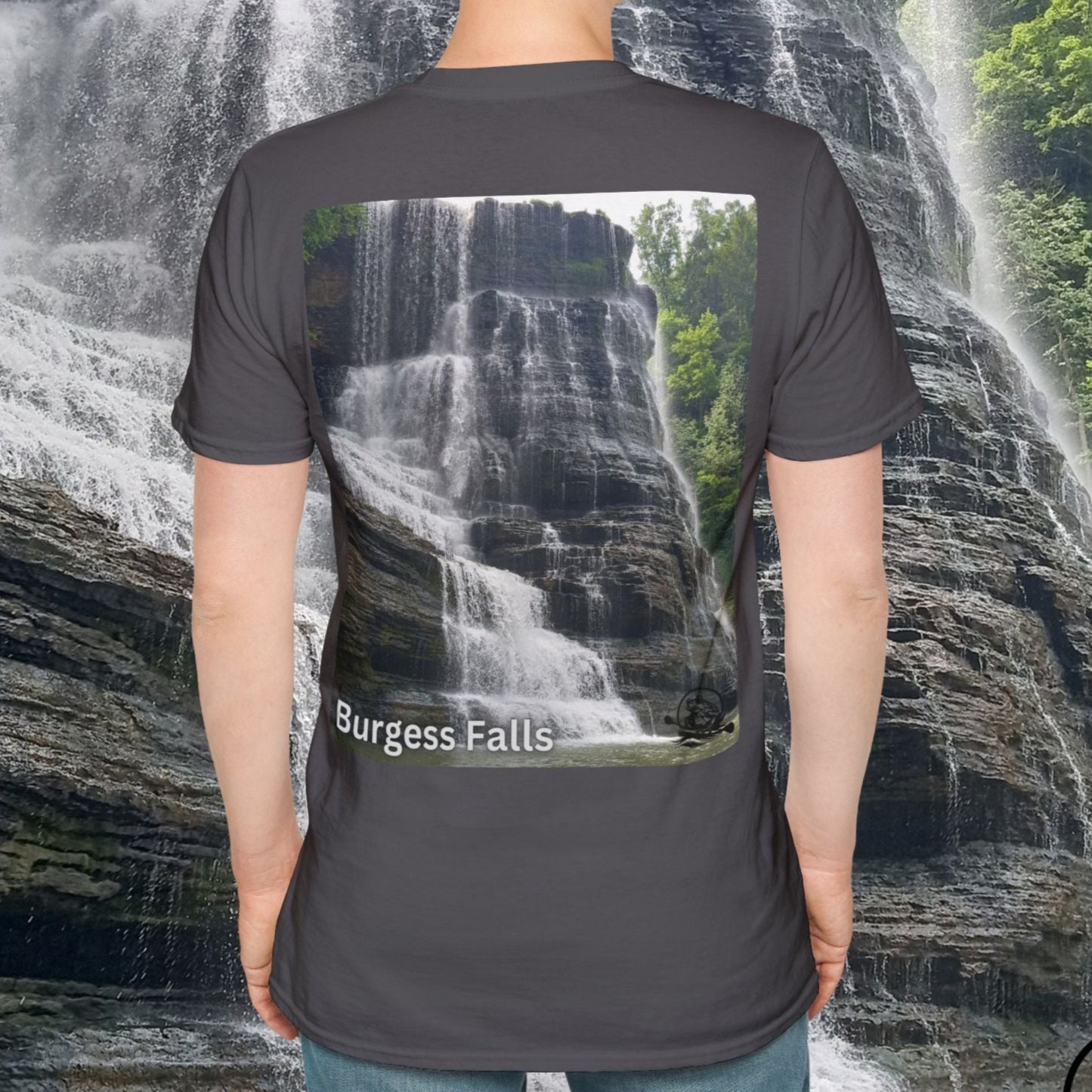 Person wearing a t-shirt with a waterfall design in front of a real waterfall. Burgess Falls in Sparta Tennessee