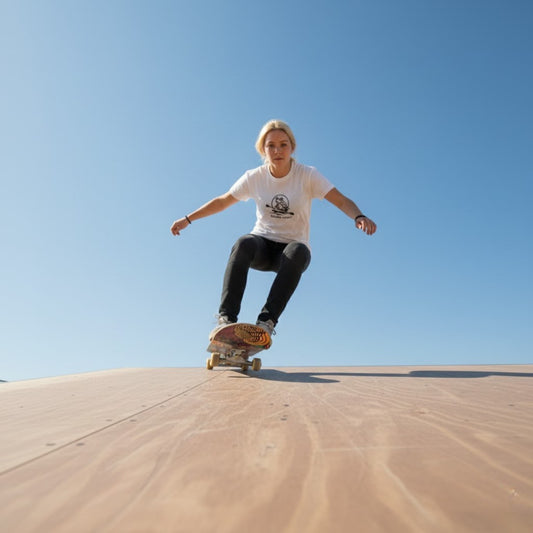 Riding down the ramp riding The Maze 7.5 popsicle skateboard deck by Paddle Frogs