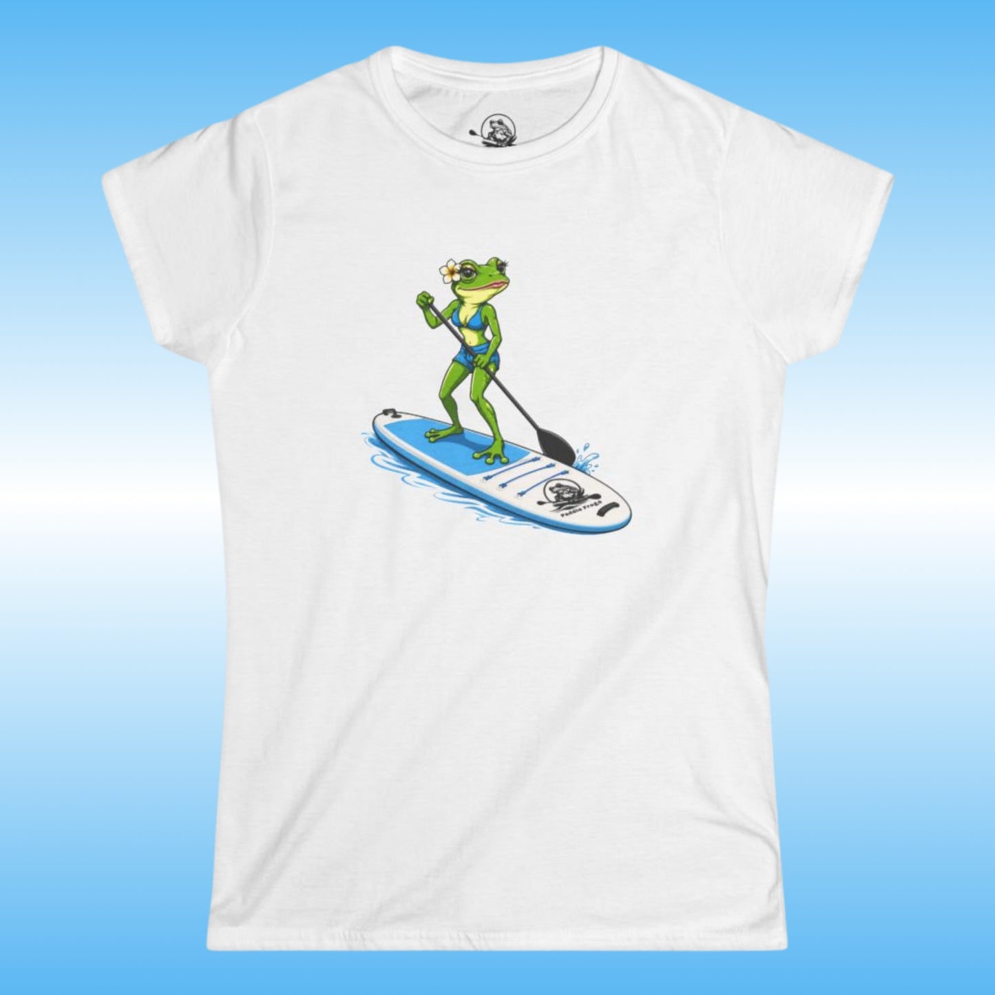 A white woman's tee with a lady frog stand up paddle boarding graphic. By Paddle Frogs outdoor gear