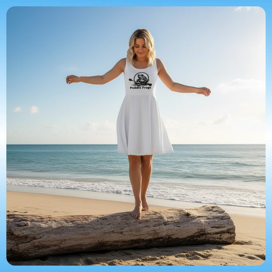 model balance on a log at the beach wearing Paddle Frogs™ White Whisper Dress | Elegance for Every Adventure
