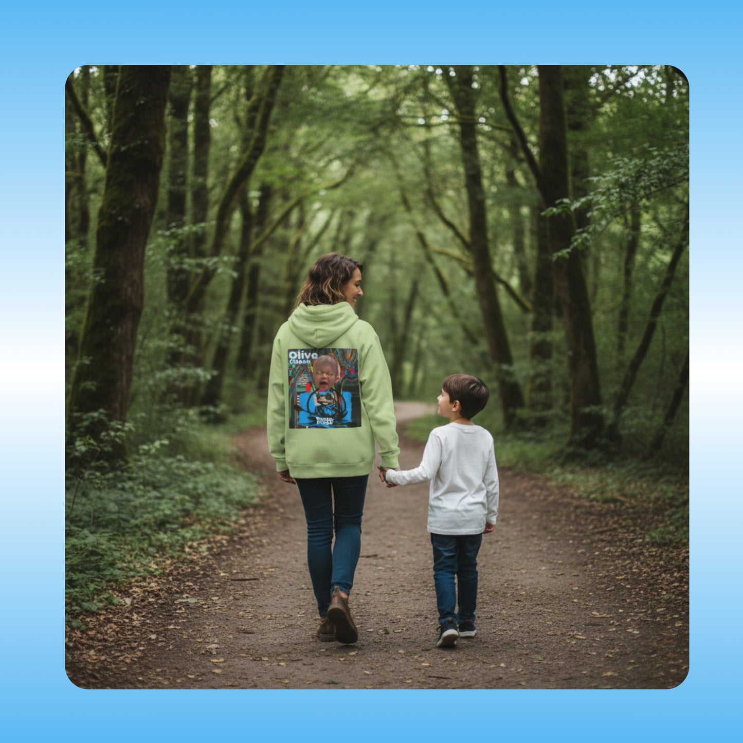 olive Chaos Paddle Frogs Outdoor Gear Hoodie pull over coat green Two people walking down a path in a forest with a focus on the person in the green jacket with a colorful design.