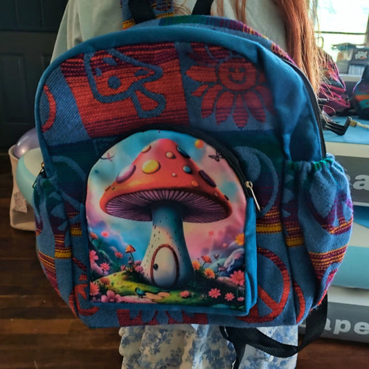 Colorful backpack with mushroom design held by a person