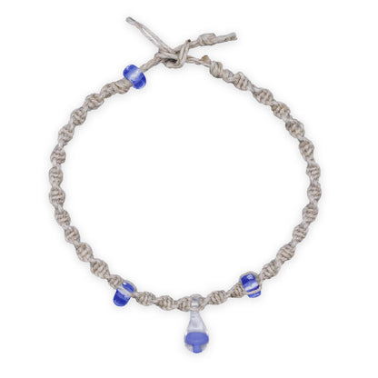 Bracelet with blue beads on a white background