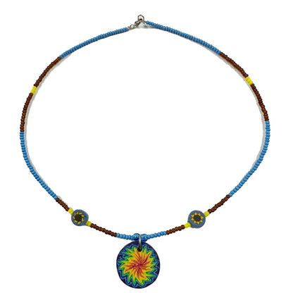 Necklace with a colorful circular pendant on a white background