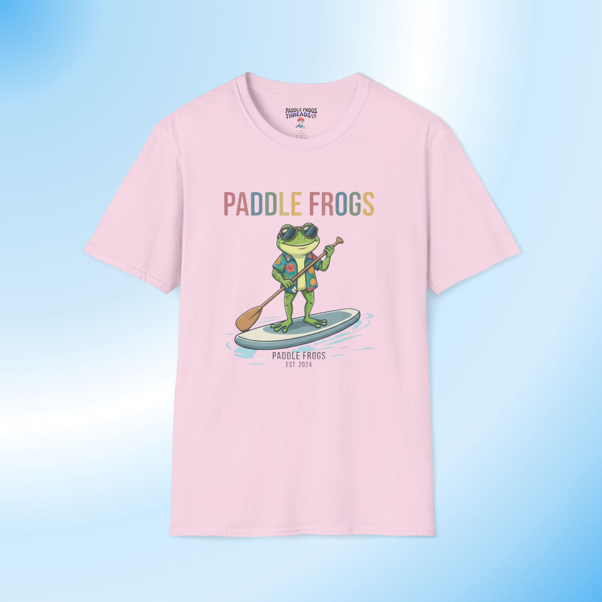Paddling Frog Tee by Paddle Frogs Outdoor Gear brand a frog SUP paddling in glasses and a vacation Hawaiian shirt light pink 100% cotton paddleboarding t-shirt.