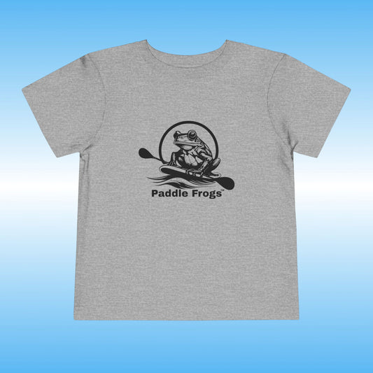 Gray t-shirt with black frog graphic and 'Paddle Frogs' text on a blue gradient background
