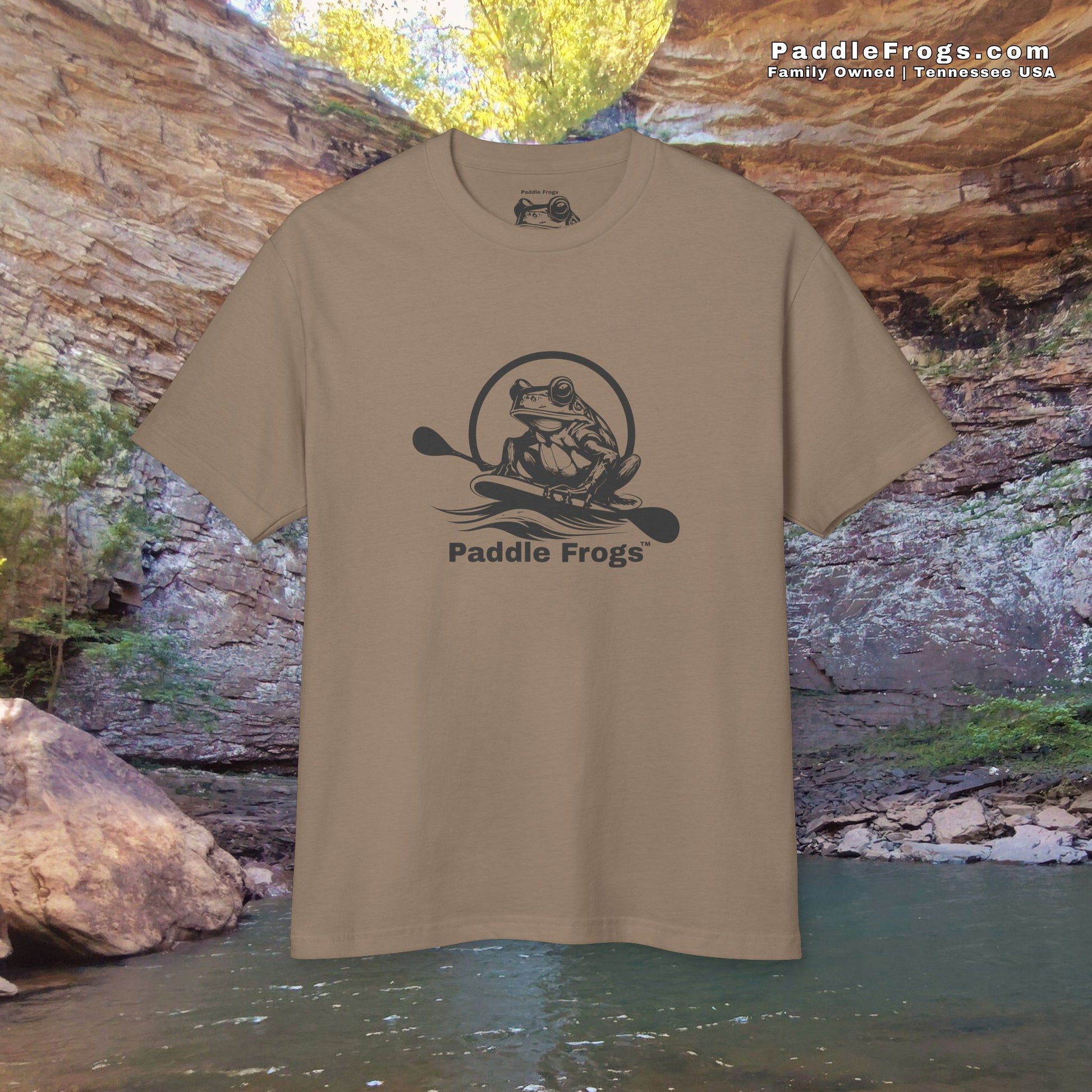 Paddle Frogs Brown t-shirt with 'Paddle Frogs' logo in front of a natural rock formation at Ozone Fall in Rockwood Tennessee.
