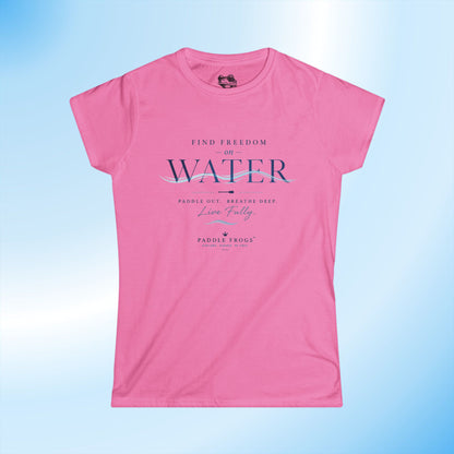 A pink short-sleeve crewneck t-shirt with a graphic print on the front reading 'FIND FREEDOM ON WATER' and 'Paddle Out. Breathe Deep.