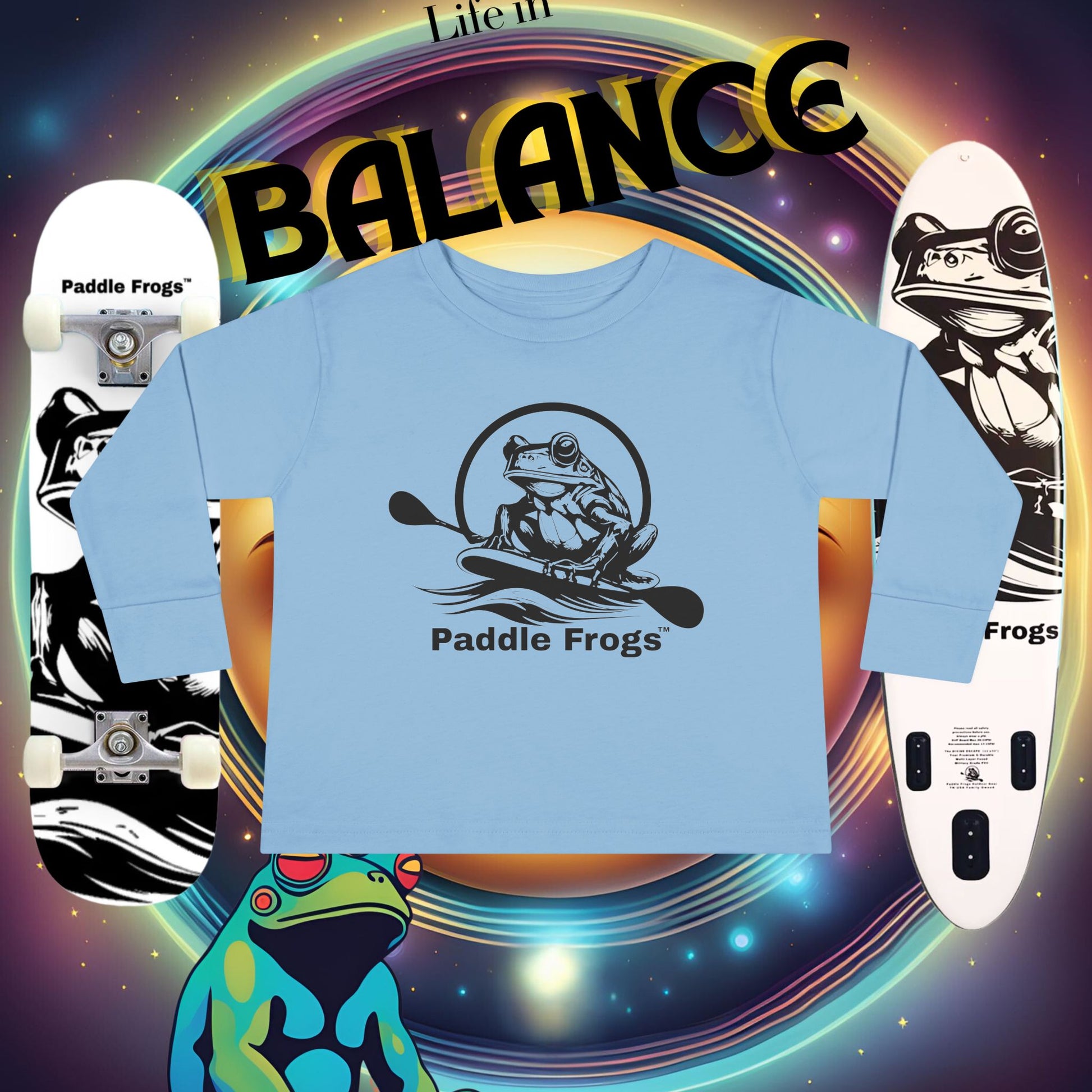 Blue t-shirt with 'Paddle Frogs' logo on a colorful background with skateboards and frogs.
