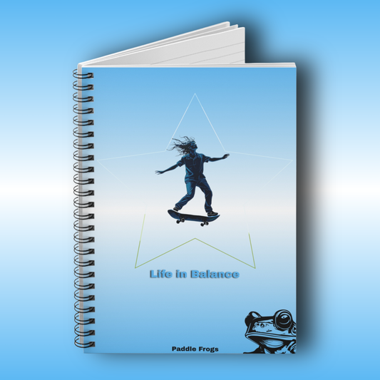 Paddle Frogs Journal Notebook with a design of a person skateboarding and text 'Life in Balance' on a blue background