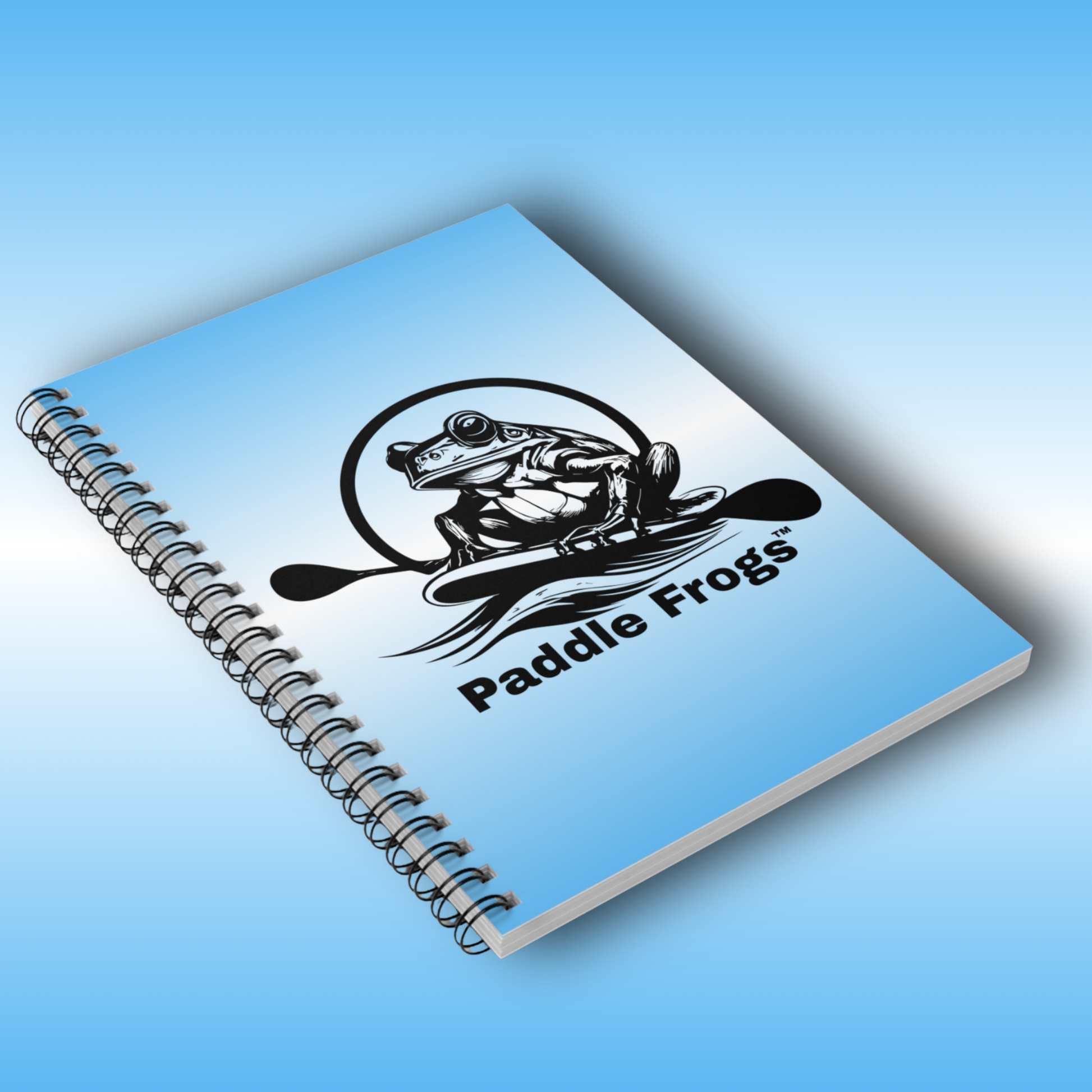 Journal art travel Notebook with 'Paddle Frogs' logo on a blue background