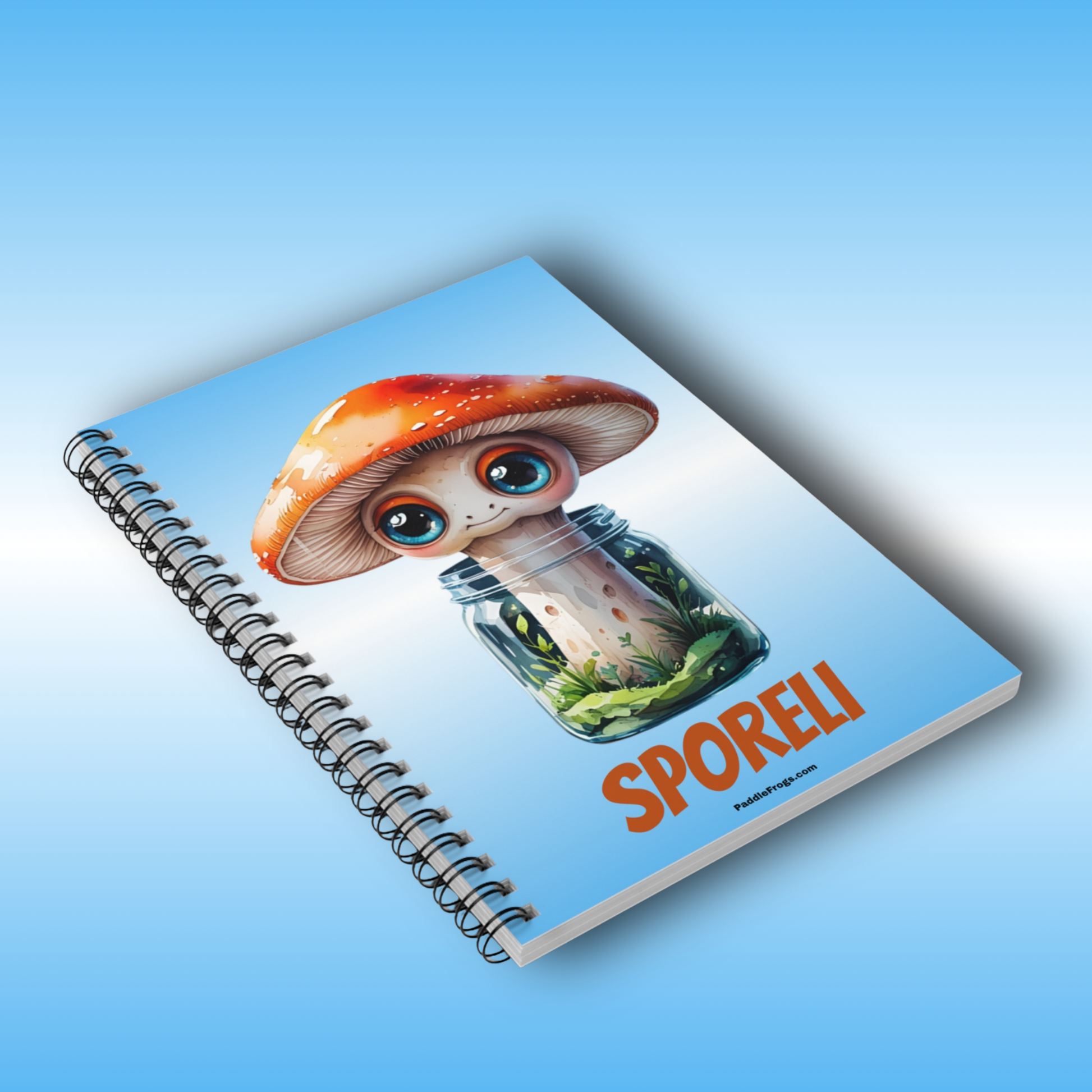 Paddle Frogs Journal Notebook with a mushroom design and 'SPORELI' text on a blue background