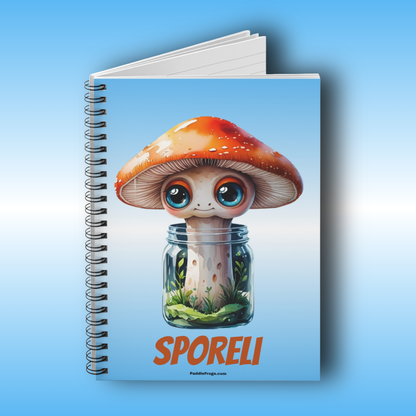 Paddle Frogs Sporeli Journal Notebook with a cartoon mushroom design on a blue background