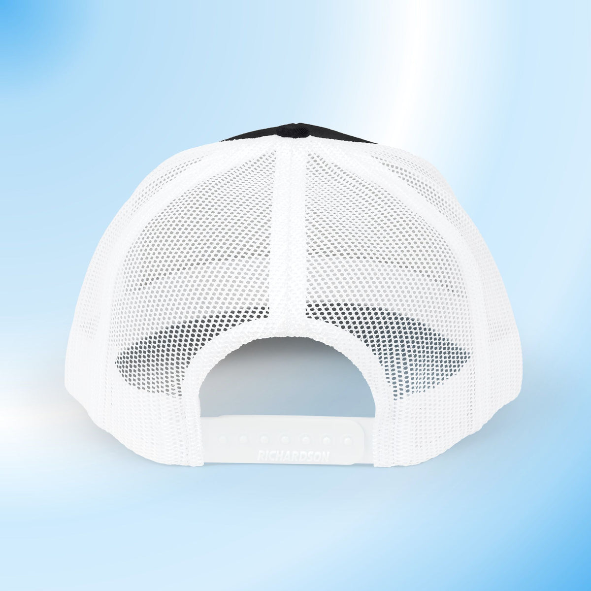 White mesh trucker cap shown from the back, featuring a black top panel and adjustable snap closure, set against a light blue gradient background.