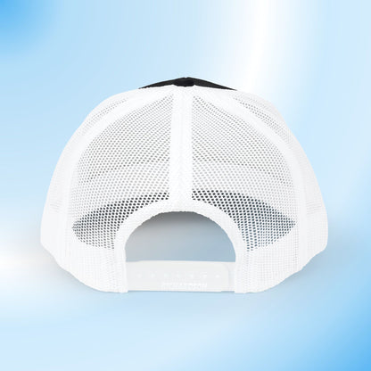 White mesh trucker cap shown from the back, featuring a black top panel and adjustable snap closure, set against a light blue gradient background.
