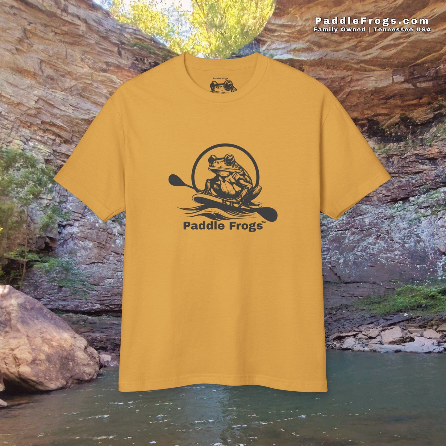 Yellow t-shirt with 'Paddle Frogs' logo in front of a natural landscape at Ozone Falls Natural Area in Rockwood Tennessee 