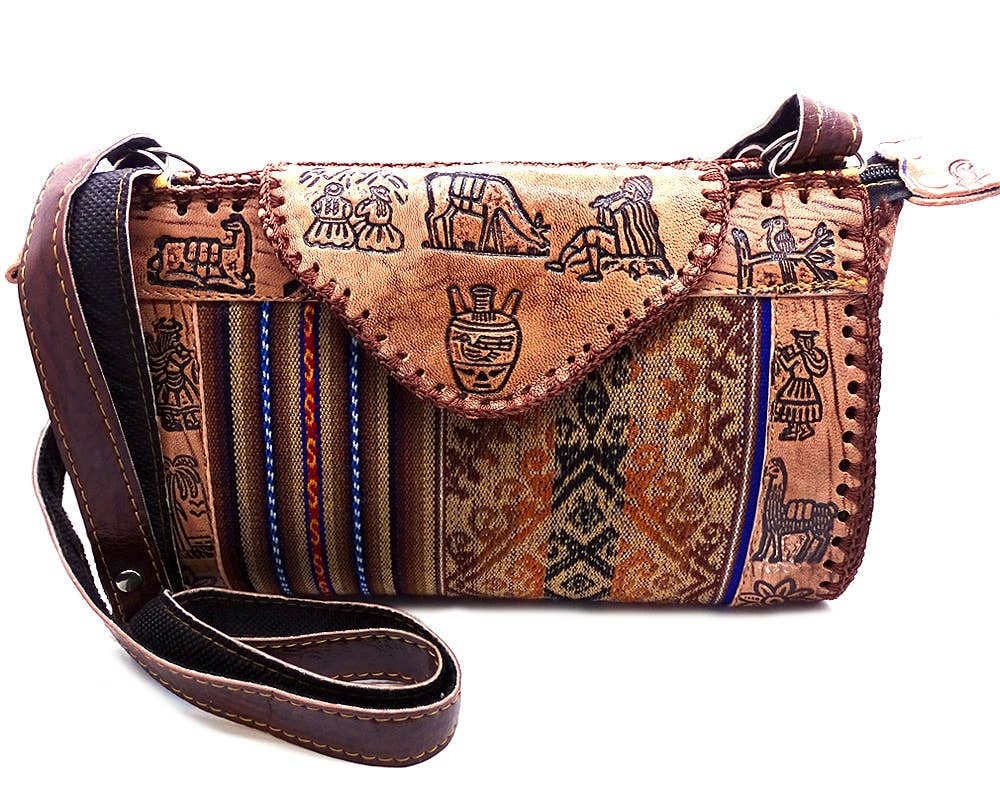 Brown leather handbag with tribal patterns on a white background
