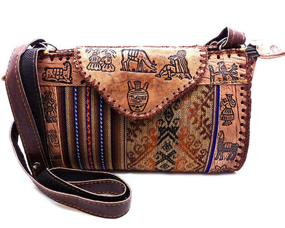 Brown leather handbag with tribal patterns on a white background