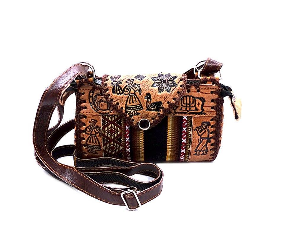 Brown leather purse crossbody bag with intricate patterns on a white background