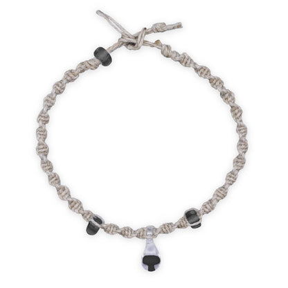 Bracelet with braided design and black beads on a white background
