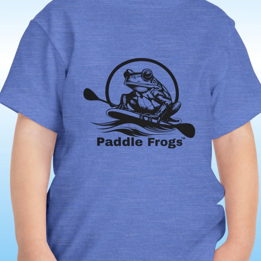 Child wearing a blue t-shirt with 'Paddle Frogs' logo on a blue background