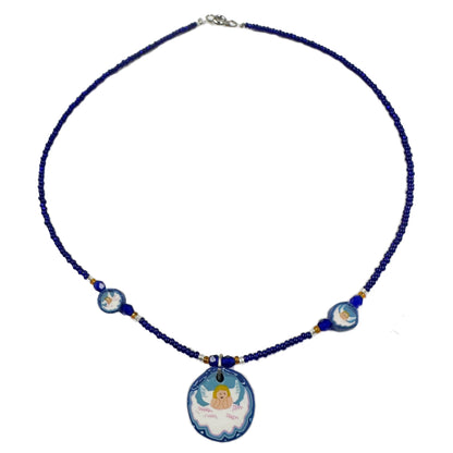 Necklace with blue beads and angel pendant on a white background