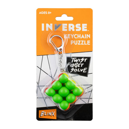 Inverse keychain puzzle with green balls and orange accents on a white background