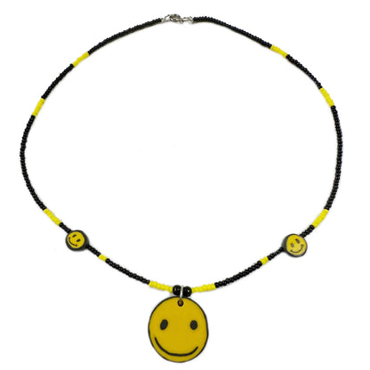 Necklace with smiley face pendants on a white background