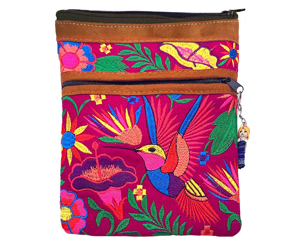 Colorful embroidered bag with floral and bird patterns on a white background