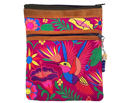 Colorful embroidered bag with floral and bird patterns on a white background