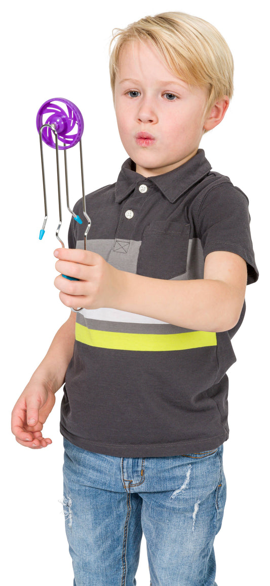 Child holding a purple magic toy against a white background