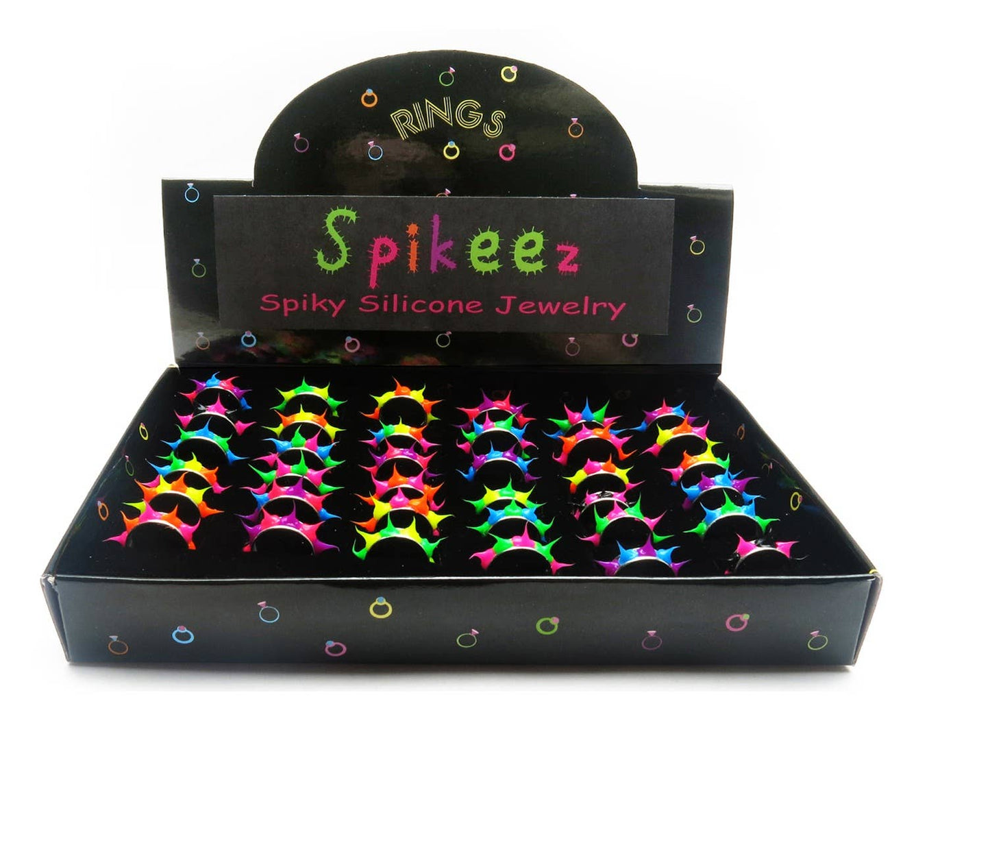 A display box of Spikeez Spiky Silicone Jewelry rings on a white background. The black display box features a sign reading 'Spikeez Spiky Silicone Jewelry' and is filled with multiple neon-colored spiky rings in pink, green, yellow, and blue.