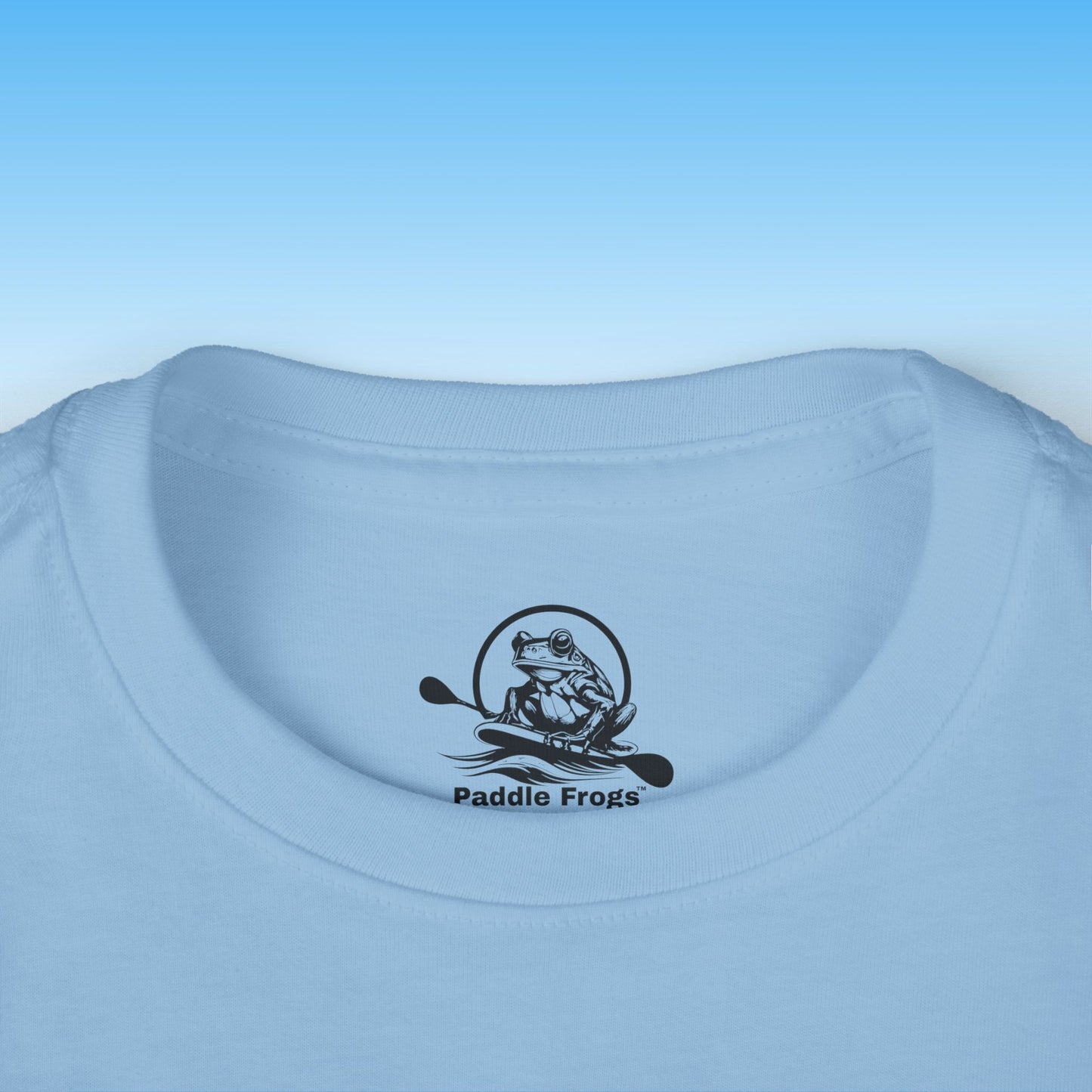 Light blue t-shirt with 'Paddle Frogs' logo on a light blue background