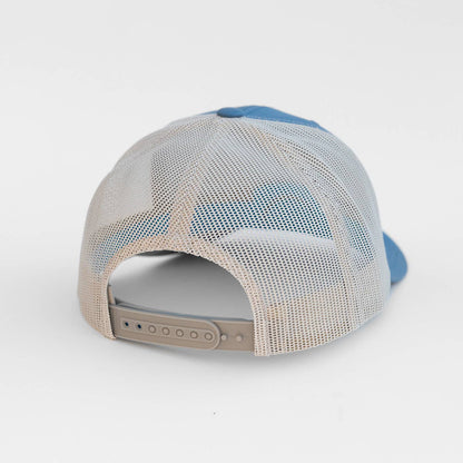 Baseball hat with blue and beige design on a white background