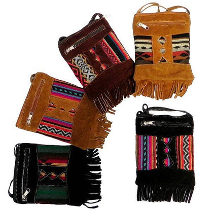 Collection of colorful handbags with tribal patterns and fringes on a white background