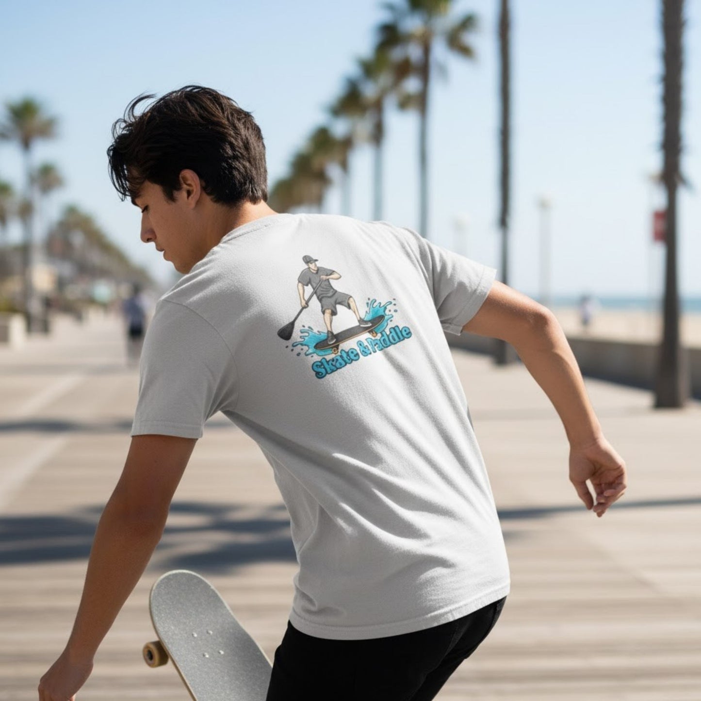 Asphalt Meets Water | Skate & Paddle Tee by Paddle Frogs™ Backside Ice Grey color man skateboarding at the beach