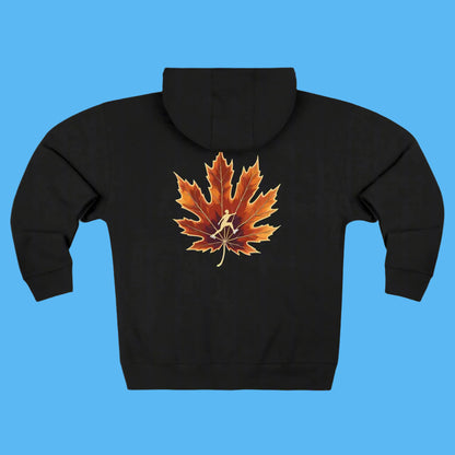 Autumn Trail Ice Skating edition 2025 - 2026 dark gray hoodie with a colorful leaf design on the trail to the Paddle Frogs crew fall hangout Black hoodie with a brown maple leaf design on the back against a white background
